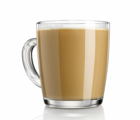 A glass cup of coconut cream coffee.